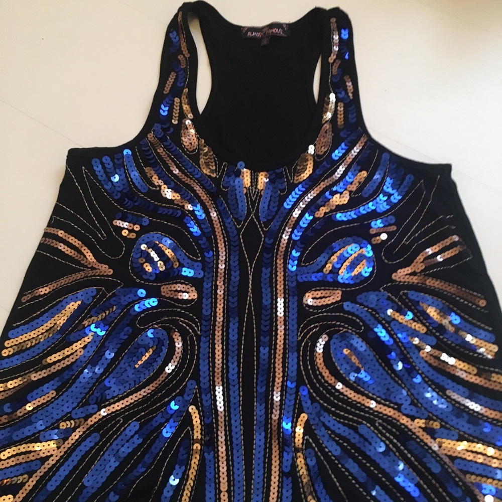 Nice black top with blue and gold sequins!